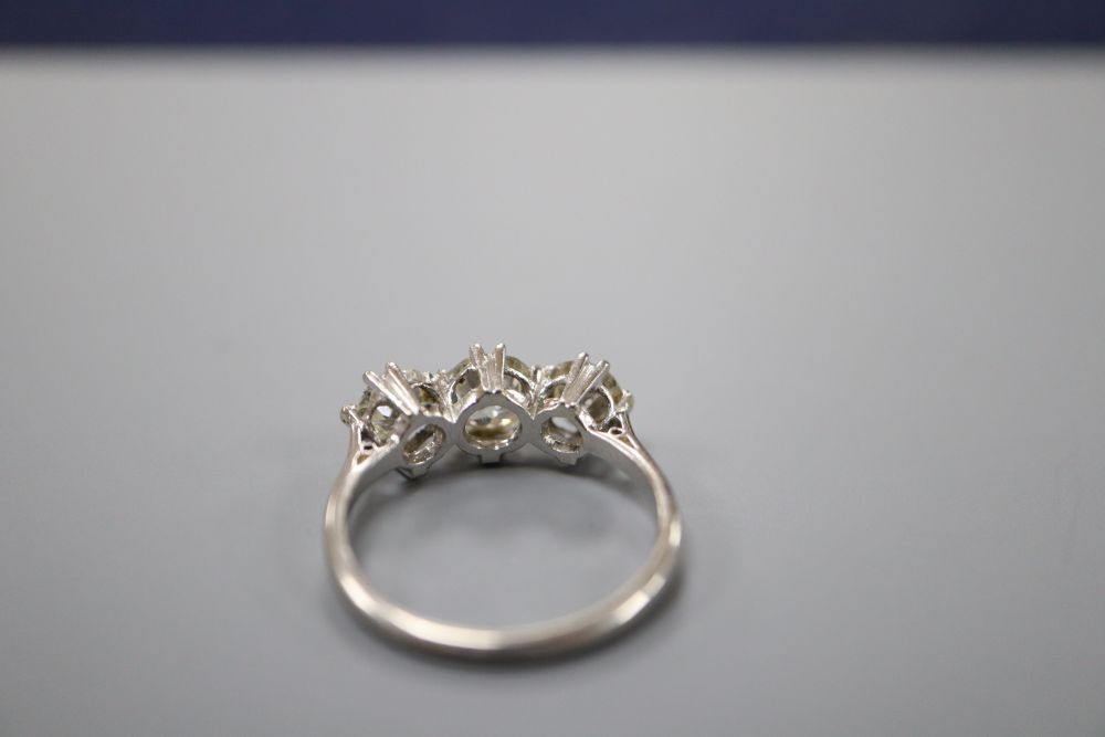 A platinum and three stone diamond ring, size N, gross 4.1 grams.